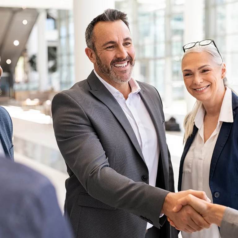 Driver greeting a passenger with a handshake